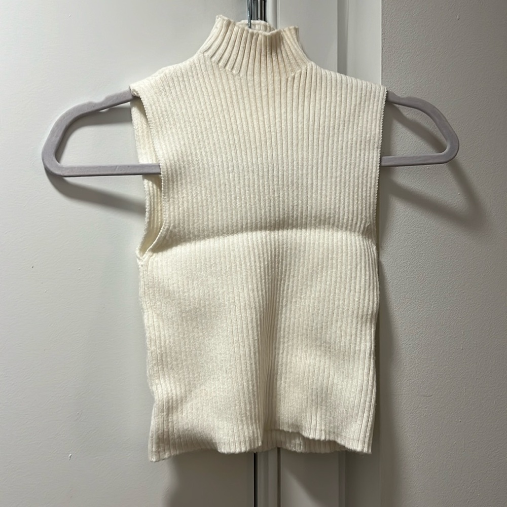Zara white sleeveless mockneck sweater. Snug fit.   Crease in pic due to folding